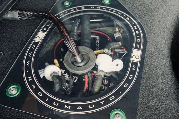 Radium 20-0736 fuel pump access cover installed in Mazda RX-7 FD3S
