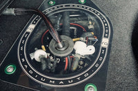 Radium 20-0736 fuel pump access cover installed in Mazda RX-7 FD3S
