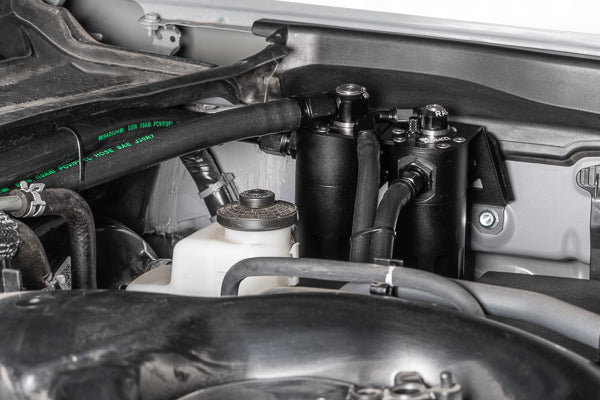 Radium 20-0840-FL dual catch cans installed in a Toyota Tacoma