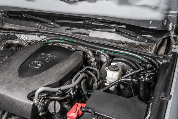 Radium 20-0840-FL dual catch can kit installed in a Toyota Tacoma
