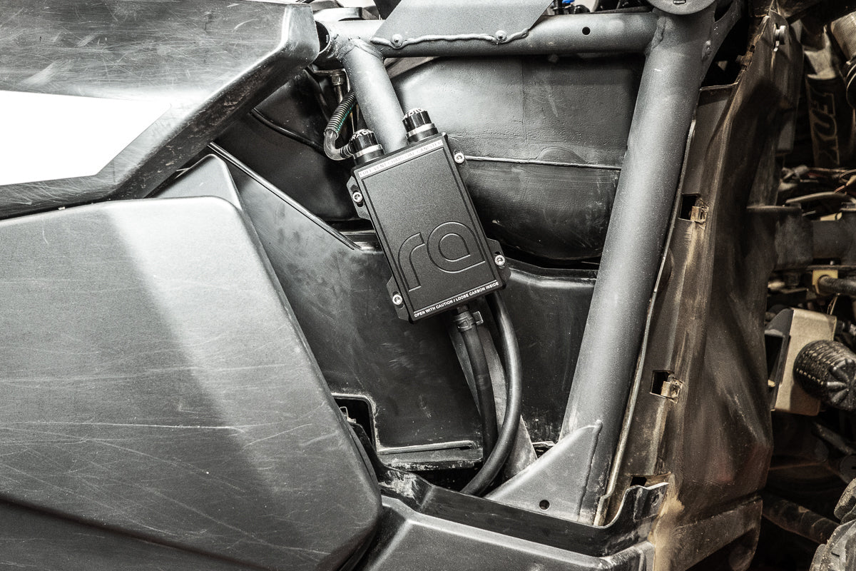 Radium charcoal canister mounted under Can-Am Maverick RH front fender