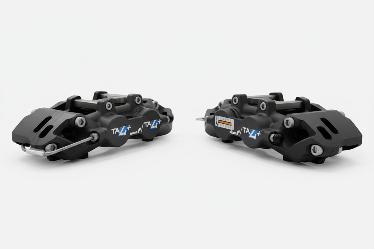 Pair of Alcon TA4+ brake calipers on white background