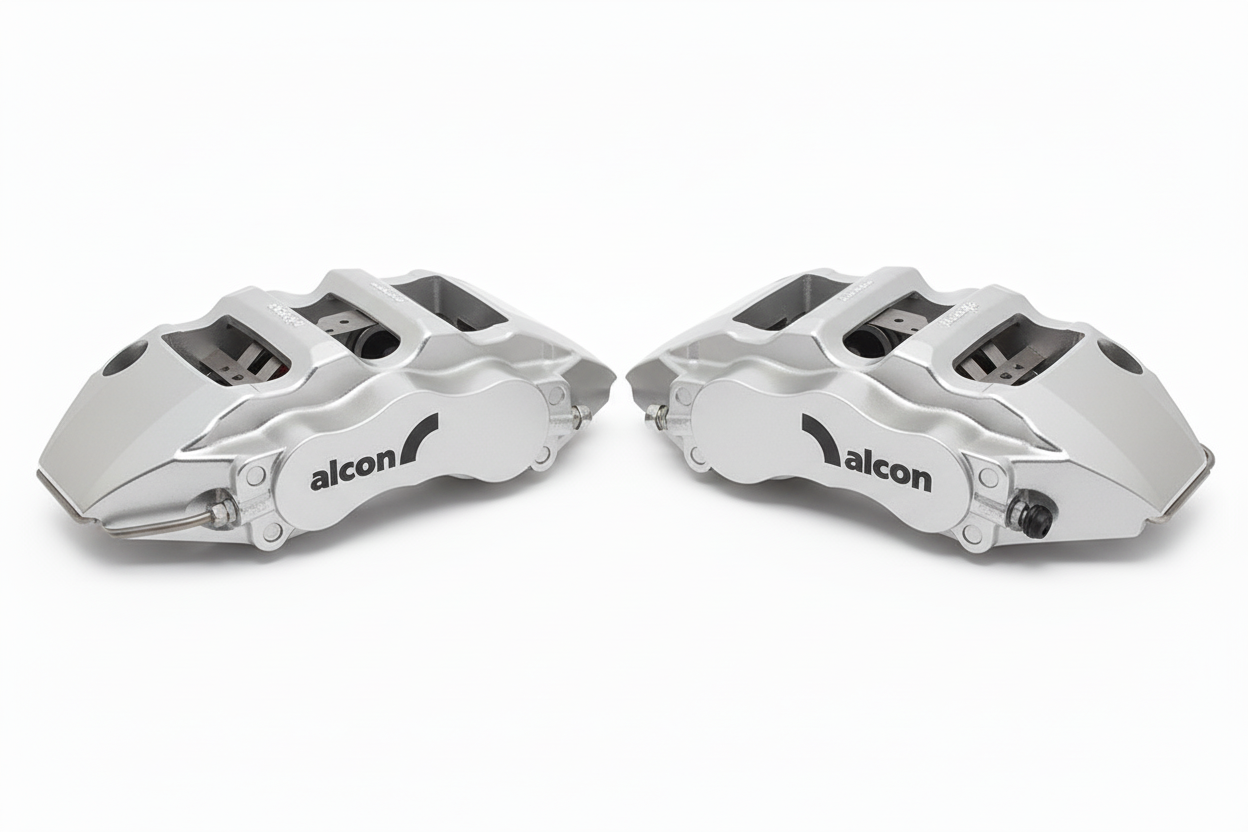 Silver Alcon brake calipers pair with black branding
