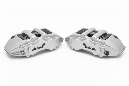 Silver Alcon brake calipers pair with black branding