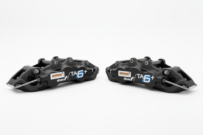 Two Alcon TA6+ callipers - bright white background